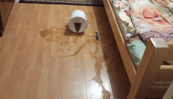 One of the buckets of sewage spilt onto the bed where the priest's grandson was sleeping. Photo: pravoslavna.volyn.ua